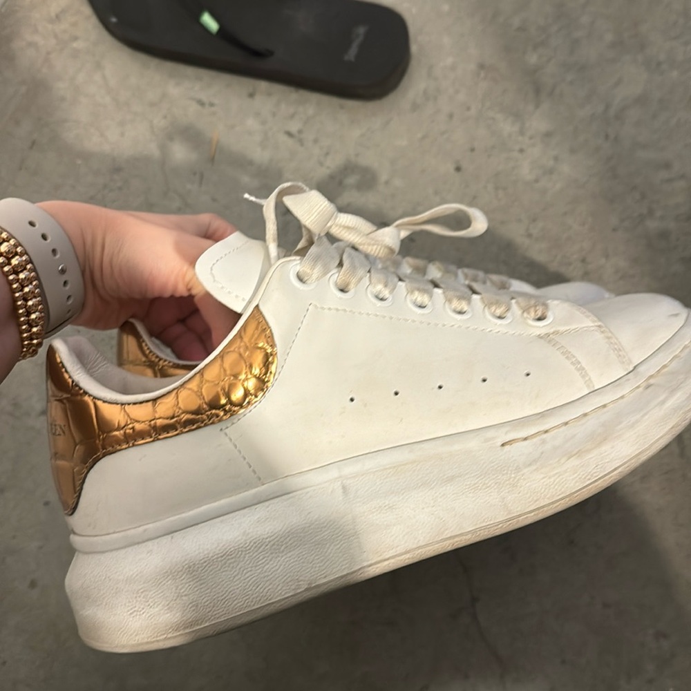 Alexander McQueen sneakers with gold crocodile back